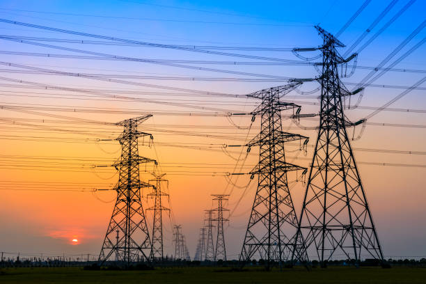 istock High voltage tower silhouette and sky landscape at dusk 1183904693