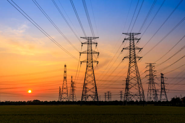 istock High voltage tower silhouette and sky landscape at dusk 1183904838