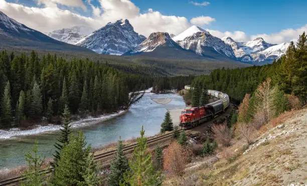 Photo of Train Coming Through A Valley in Banff Canada