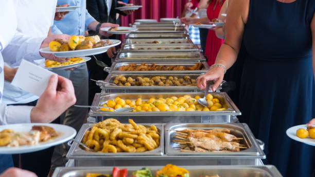 istock The reception guests put food in the dish. 1183905853