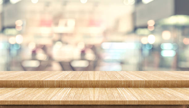 istock Empty step wood table top ( food stand ) with blur customer dining at cafe restaurant background bokeh light,Mock up for display or montage of product,Banner for advertising online media.. 1183905953