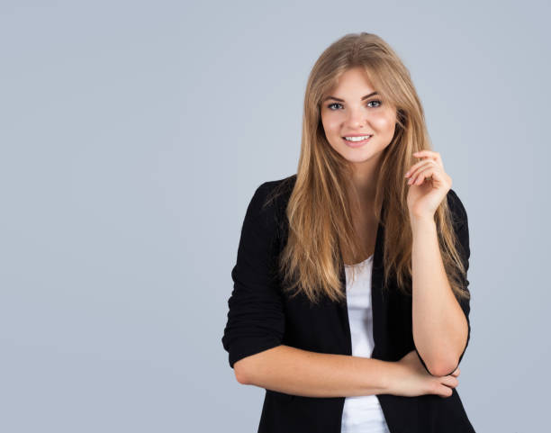istock Blonde girl on grey background 1183908404
