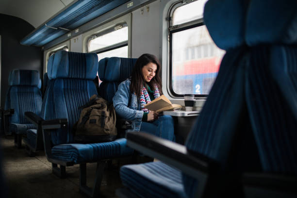 Women reading book on the train stock photo