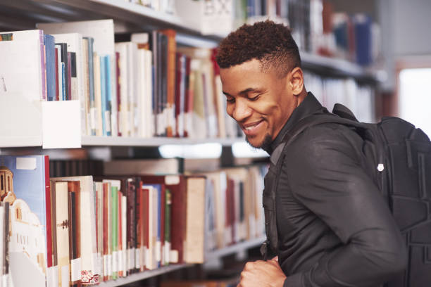 istock Books never get old. African american man in the library 1183914777