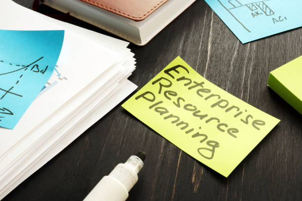 istock ERP - Enterprise resource planning concept. Stack of business papers. 1183915999