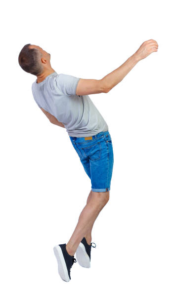 istock Back view of a man dancing in shorts. 1183917844