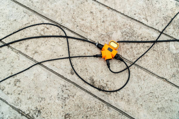istock The electrical wire is connected to the orange electrical plug. 1183921520