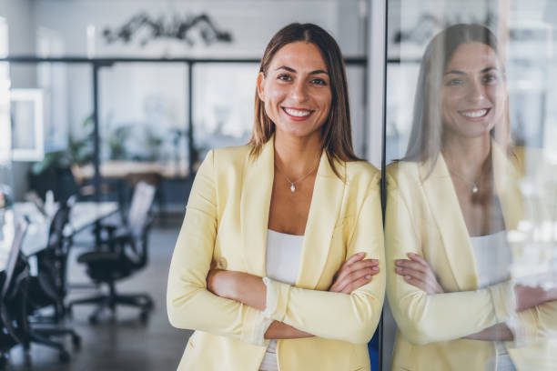 Portrait of confident business woman Portrait of confident beautiful business woman with arms crossed at the office powerful women stock pictures, royalty-free photos & images