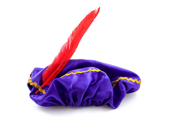 purple hat of Zwarte Piet purple hat with red feather of Zwarte Piet, typical Dutch event in december zwarte piet stock pictures, royalty-free photos & images