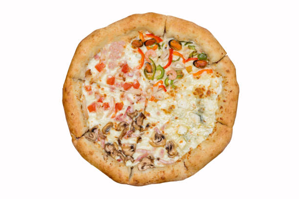 Fresh Italian Four Seasons Pizza or Pizza Quattro Stagioni on the wooden kitchen table with different bright ingredients. Focus stacking.