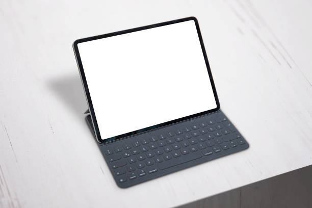 istock Tablet with keyboard mockup. Office desk. Close-up. Isolated screen for app or web site design promotion. Isometric position. 1183925078