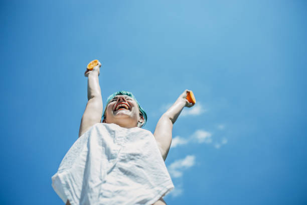 istock Woman and oranges 1183926801