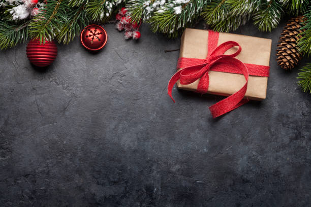 istock Christmas card with decorated fir tree and gift 1183926944
