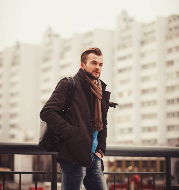 istock handsome man in an autumn coat 1183927304