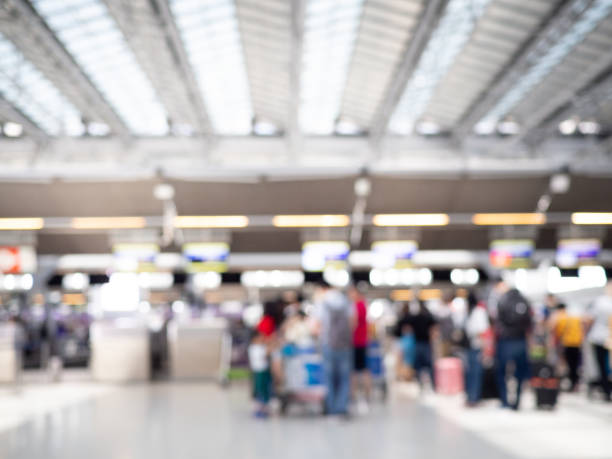 istock Abstract Blur Background : Airport Check-In Counters With Passengers 1183927555