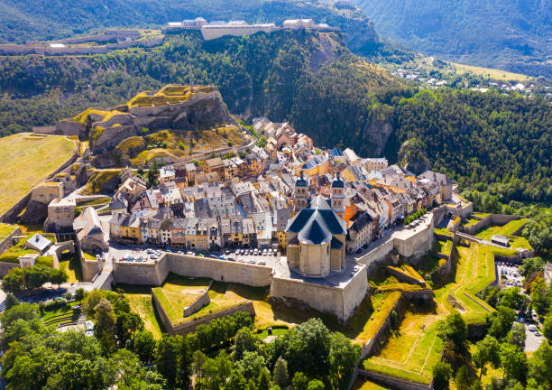 Aerial view of Briancon Aerial view of French fortified town of Briancon overlooking ancient fortress on hilltop and two belfries of parish church hautes alpes photos stock pictures, royalty-free photos & images