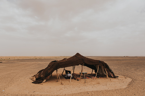 A berber camp tent in the middle of the Sahara desert.