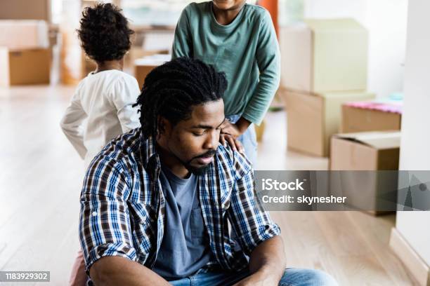 Worried African American Single Father With His Kids At New Apartment Stock Photo - Download Image Now