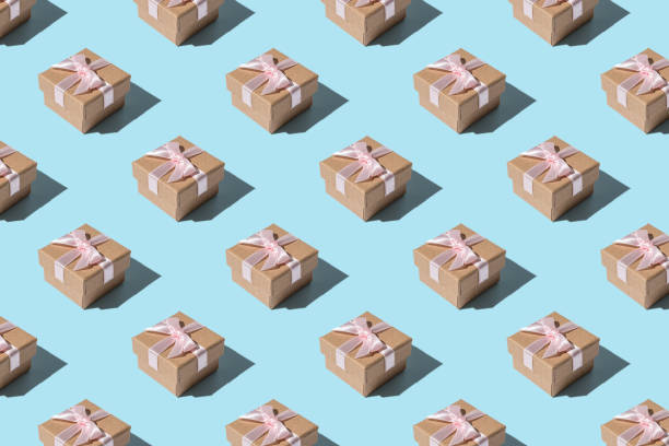 istock Creative Christmas pattern made of Gift box on bright blue background. Minimal Christmas or New Year concept. 1183931866