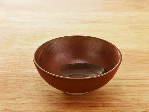 a bowl on the wood background