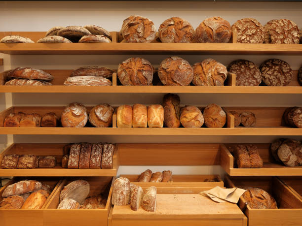 istock Modern bakery with different kinds of bread, cakes and buns 1183933978