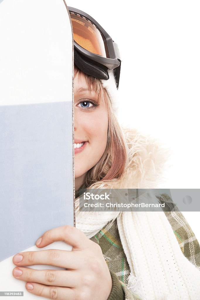 Smiling young female snowboarder  20-24 Years Stock Photo