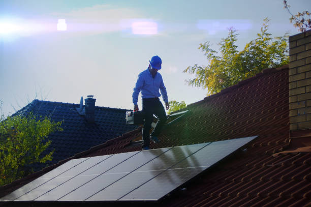 istock Technician installs solar panels on the roof 1183935897