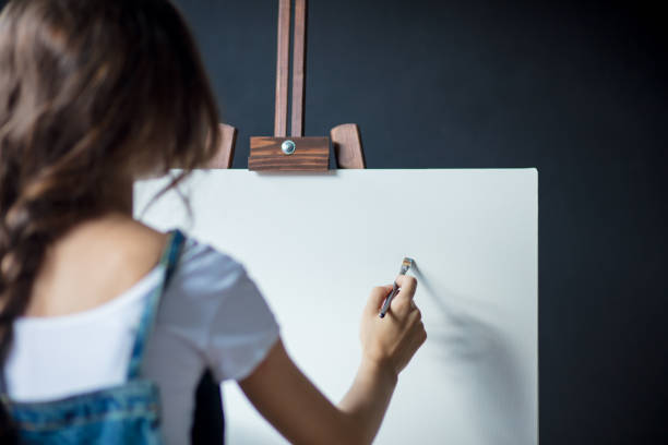 istock Woman painting 1183936014