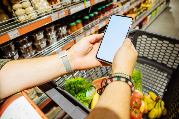 istock phone with empty blank white screen shopping cart on background copy space 1183936954