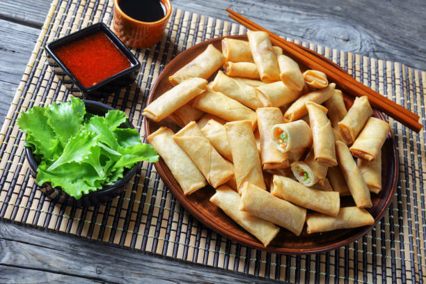 istock deep fried crispy bite-sized chinese spring rolls with cabbage, carrots and green peas fillings 1183937303