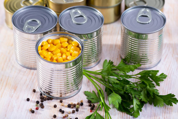 istock Canned pickled corn on a wooden table 1183939402