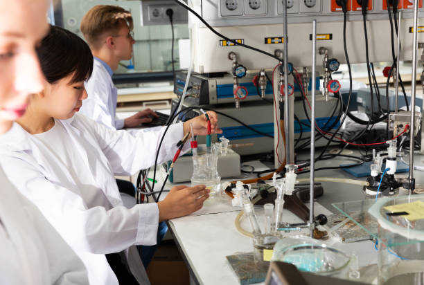 istock students chemists working in university research laboratory 1183940087