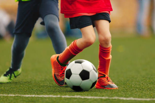 istock Children Running With Soccer Ball 1183940129