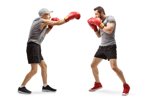 istock Senior man and a young man boxing 1183940371