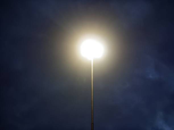 istock street lamp shines at night 1183941450
