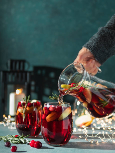 istock Winter sangria pouring in glasses, christmas table 1183941662