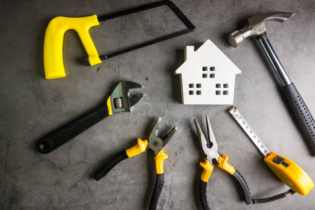 istock Wooden house and construction tools on stone pattern background with copy space.Home Repair concept, Repair maintenance concept, Renovation concept. 1183943330