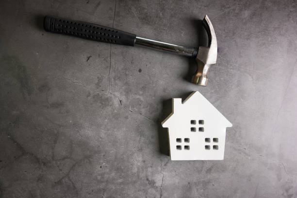 istock Wooden house and construction tools on stone pattern background with copy space.Home Repair concept, Repair maintenance concept, Renovation concept. 1183943364