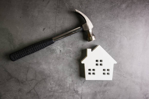 istock Wooden house and construction tools on stone pattern background with copy space.Home Repair concept, Repair maintenance concept, Renovation concept. 1183943439