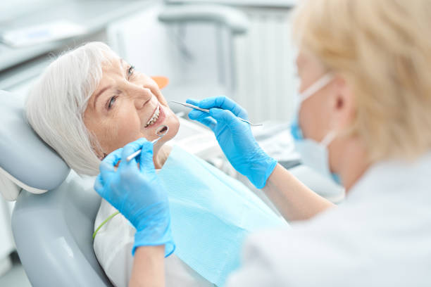 istock Elderly patient treating her teeth at the dentist office 1183945424