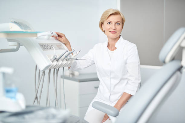 istock Pleasant dentist is sitting in her cabinet 1183945469