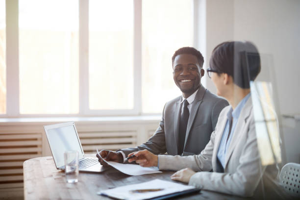 istock Smiling Business People Working in Office 1183945553