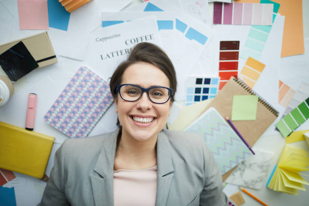 istock Smiling Businesswoman Lying on Floor 1183945700