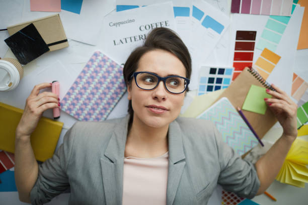 istock Frustrated Businesswoman Lying on Floor 1183945704