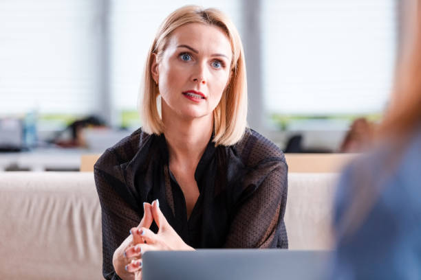 istock Confident businesswoman discussing in office 1183945905