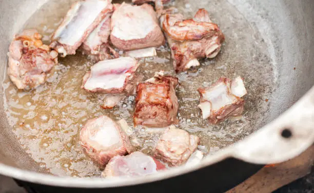 Photo of Pieces of beef on bones, close up