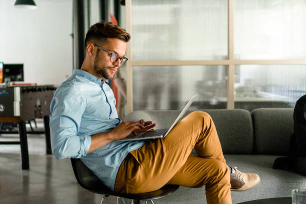 istock Young man typing on laptop 1183948747