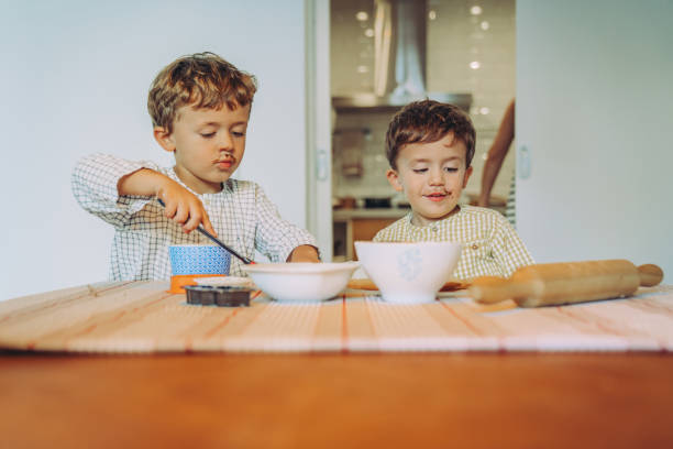 istock Family making Halloween cookies 1183949012