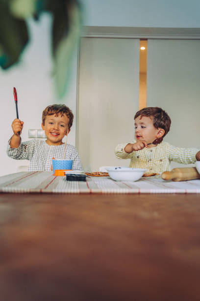istock Family making Halloween cookies 1183949312