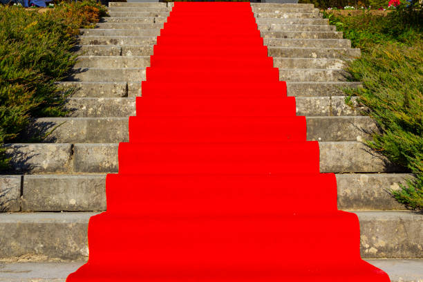 istock Red carpet over stairs 1183950587